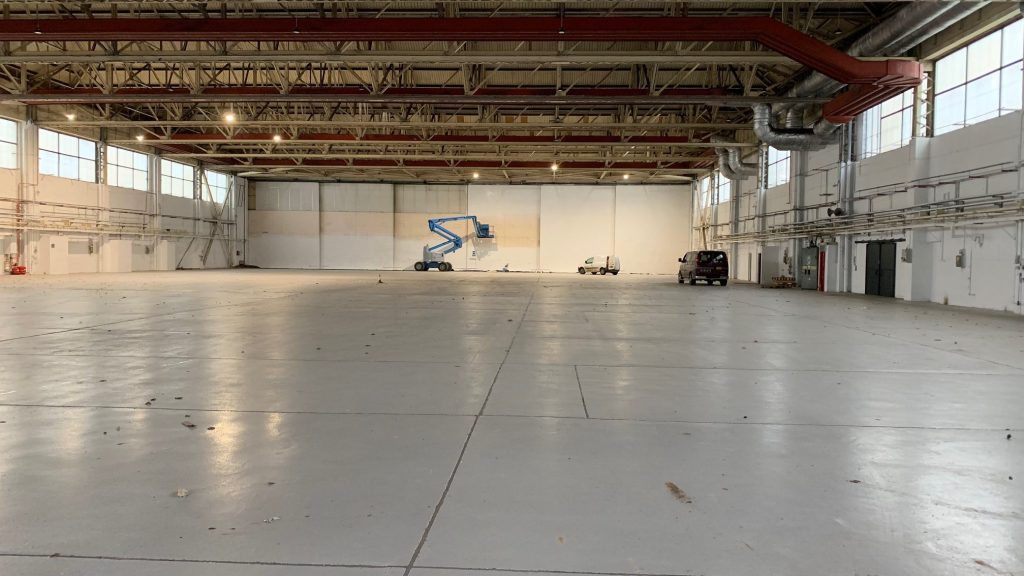 Image of hangar being decorated with cherry picker